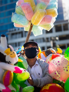 Sam Comen, Alberto Gomez, Candy and toy vendor from the series The Longest Shift, 2020; Digital photograph, 36 x 27 inches; Courtesy of the artist.