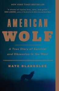book cover of American Wolf by Nate Blakeslee with a wolf silhouette.