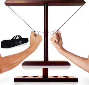 image of two hands pulling loops away from one another on a wooden game stand