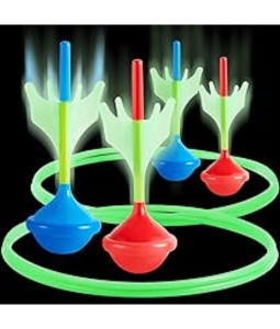 image of red and blue lawn darts landing in a green traget